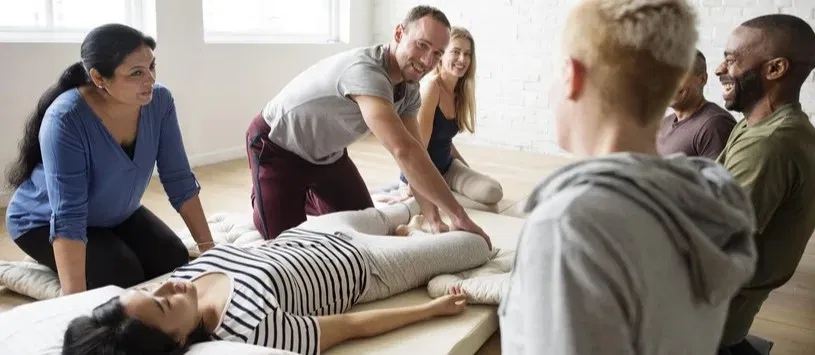 Student practicing continuing education massage techniques on another student.